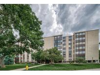 Attractive multi-story building with landscaping and a spacious lawn at 3465 S Poplar St # 406, Denver, CO 80224
