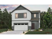 Charming two-story home with a two-car garage, professionally landscaped front yard and modern architecture at 19038 E 94Th Pl, Commerce City, CO 80022