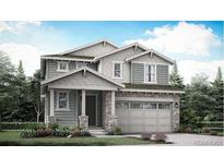 Charming two-story home with stone accents, siding and a two car garage at 7337 S Yank Ct, Littleton, CO 80123