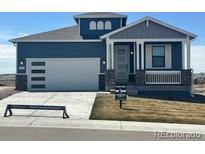 Charming home with a two-car garage, lovely front porch, and inviting curb appeal at 42996 Colonial Trl, Elizabeth, CO 80107