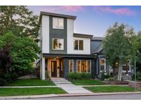 Modern two-story home with stone accents, landscaped yard, and inviting entrance at 2523 N Humboldt St, Denver, CO 80205
