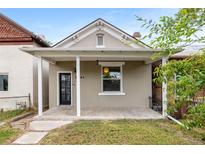 Charming bungalow featuring a covered front porch and neutral exterior paint scheme at 2841 Stout St, Denver, CO 80205