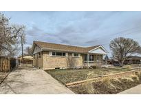 Charming brick home with a well-maintained lawn and classic design, perfect for a cozy living experience at 283 Garland Dr, Northglenn, CO 80233