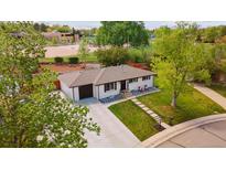Charming single-story home with a well-manicured front yard and a welcoming entrance at 45 S Reed St, Lakewood, CO 80226