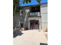 Exterior view of the apartment building entrance with dual doors and a welcoming facade at 7346 S Xenia Cir # A, Centennial, CO 80112