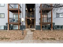 A view of the exterior of the apartment building with balconies and a walkway entrance at 16259 W 10Th Ave # I2, Golden, CO 80401
