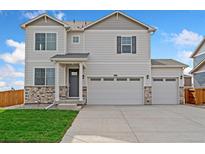 Charming two-story home with a three car garage and stone accents at 13804 Quartz St, Mead, CO 80504