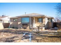 Brick ranch home with landscaped yard and walkway at 3690 Ivy St, Denver, CO 80207