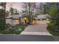 Charming single-Gathering home featuring a beautiful stone driveway and lush landscaping at 474 Silbrico Way, Castle Rock, CO 80108