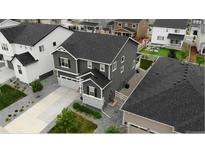 A stunning aerial view showcases this home's well-manicured lawn and desirable neighborhood setting at 2637 Gray Wolf Pl, Castle Rock, CO 80104