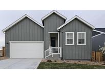 Charming single-Gathering home with gray siding, white trim, and an attached two-car garage at 17125 W 92Nd Loop, Arvada, CO 80007