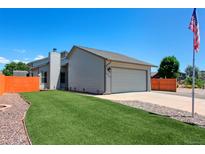 Charming single-Gathering home with a manicured lawn, fenced yard and two car garage in a suburban setting at 2800 Troxell Ave, Longmont, CO 80503