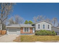 Charming one-story home features a well-maintained front yard and classic architectural details at 907 Stein St, Lafayette, CO 80026