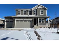 Two-story house with gray siding, stone accents, and a two-car garage at 3886 N Irvington St, Aurora, CO 80019