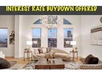 Bright living room with stylish furniture, large windows, and a modern chandelier showcasing city views at 1521 Central St # 3C, Denver, CO 80211