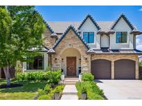 Charming stone and stucco home with manicured landscaping and an arched entryway at 115 S Glencoe, Denver, CO 80246