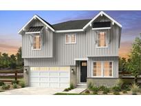 Charming two-story home featuring a light gray exterior, a two-car garage, and stylish architectural details at 16488 W 92Nd Pl, Arvada, CO 80007