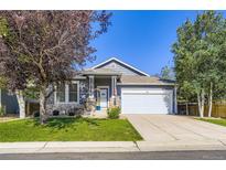 Charming single-Gathering home with well-maintained lawn and attached two-car garage at 12 Apache Plume St, Brighton, CO 80601