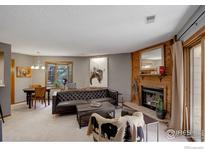 Inviting living room with a fireplace, comfortable seating, and stylish decor, creating a cozy ambiance at 2962 Shadow Creek Dr # 109, Boulder, CO 80303