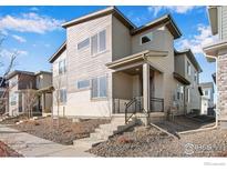 Two-story home featuring modern architecture, a welcoming front porch, and low-maintenance landscaping for easy living at 1580 E 3Rd Ave, Longmont, CO 80501