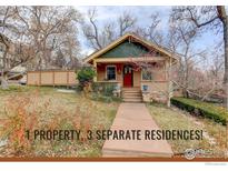 Charming Craftsman home with red door, stone steps, and landscaped yard at 2238 15Th St, Boulder, CO 80302