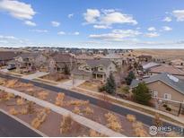 Charming neighborhood street view of an attractive two-story home with an attached garage and well-maintained landscaping at 7690 S Blackstone Pkwy, Aurora, CO 80016