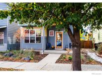 Charming Craftsman home with gray siding, landscaping, and a welcoming front porch at 1434 Zamia Ave, Boulder, CO 80304