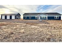 Ranch-style home with attached garage and expansive yard at 17913 Slavin Way, Platteville, CO 80651