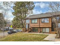 Exterior of a charming townhome with wood siding and landscaping at 2667 Juniper Ave # 53, Boulder, CO 80304