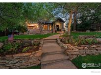 Charming home featuring beautiful stone accents, inviting walkway, and lush landscaping at 820 6Th St, Boulder, CO 80302