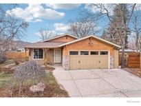 Craftsman style home with stone accents and a two-car garage at 2865 Madera Ct, Boulder, CO 80301
