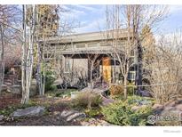 Mid-century modern home with landscaped grounds and walkway at 435 University Ave, Boulder, CO 80302