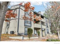 Beige multi-unit building with balconies and landscaping at 497 S Memphis Way # 10, Aurora, CO 80017