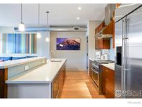 Modern kitchen with stainless steel appliances and ample counter space at 1505 Pearl St # 209, Boulder, CO 80302