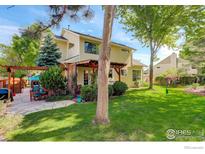 A spacious backyard with a patio and a pergola, perfect for outdoor entertaining and relaxation at 1620 Oak Ave, Boulder, CO 80304