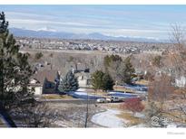 Stunning aerial view of homes with mountain backdrop at 11386 Grove St # B, Westminster, CO 80031