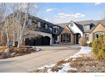 Stunning two-story home with a large driveway and landscaping at 1312 Jade Ln, Longmont, CO 80504