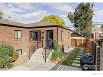 Brick home with a landscaped front yard and walkway at 1456 Quitman St, Denver, CO 80204