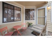 Cozy front porch with seating area, perfect for relaxing outdoors and enjoying the fresh air at 4862 E Kentucky Ave # D, Denver, CO 80246