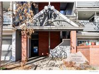 Brick building exterior with entrance and signage for Whittier Square Condominiums at 2201 Pearl St # 224, Boulder, CO 80302