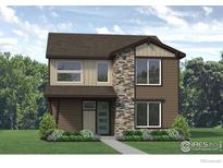 Two-story craftsman style home with stone accents and landscaping at 2315 Peregrine Dr, Brighton, CO 80601