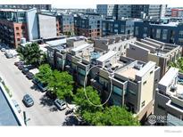 Aerial view of modern townhouses with rooftop decks, showcasing a prime urban location at 2900 Inca St # 12, Denver, CO 80202