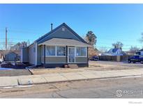 Charming bungalow with a front porch and well-maintained landscaping at 304 Mckinley Ave, Fort Lupton, CO 80621