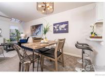 Bright dining area with rustic table and modern chairs at 4853 W Moorhead Cir, Boulder, CO 80305