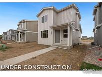 Two-story home with light beige siding and a walkway at 357 Fickel Farm Trl, Berthoud, CO 80513