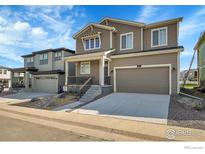 Two-story home with attached garage and landscaping at 390 Blackfoot St, Superior, CO 80027