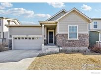 Charming ranch home with stone accents and a two-car garage at 9914 Truckee St, Commerce City, CO 80022