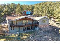 Luxury home with expansive deck and mountain views at 130 Seven Hills Dr, Boulder, CO 80302