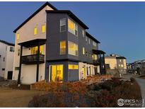 Two-story townhome with modern exterior and landscaping at 2446 W 167Th Ln, Broomfield, CO 80023