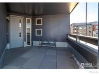 Private balcony with city views and seating at 2850 E College Ave # 402, Boulder, CO 80303